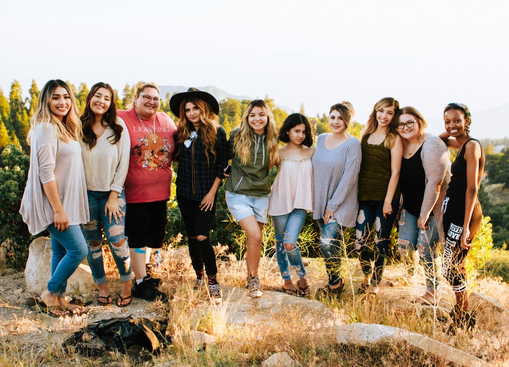 group of people standing together looking at camera